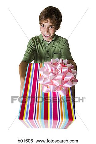 High angle view of a boy giving a gift View Large Photo Image Stock Photograph - High angle view of a boy giving a gift. Fotosearch