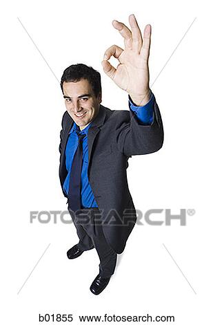 High angle view of a businessman making an OK sign View Large Photo Image Stock Photography - High angle view of a businessman making an OK sign. Fotosearch