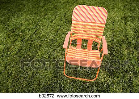 High angle view of a chair on a lawn View Large Photo Image Stock Image - High angle view of a chair on a lawn. Fotosearch