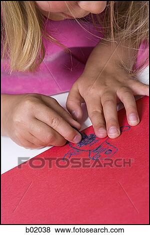 High angle view of a girl drawing on construction paper View Large Photo Image Stock Photo - High angle view of a girl drawing on construction paper. Fotosearch