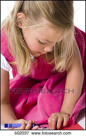 High angle view of a girl drawing using crayons View Large Photo Image Stock Photo - High angle view of a girl drawing using crayons. Fotosearch