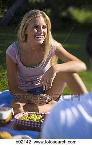 High angle view of a girl smiling in a park View Large Photo Image Stock Image - High angle view of a girl smiling in a park. Fotosearch