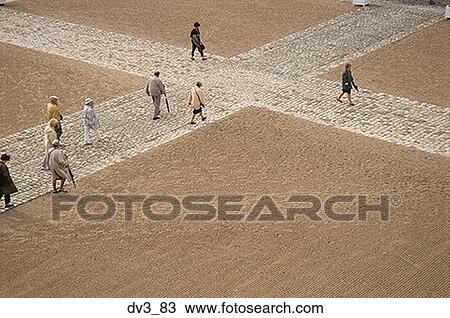High angle view of a group of people walking in a courtyard View Large Photo Image Stock Image - High angle view of a group of people walking in a courtyard. Fotosearch