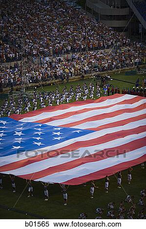 High angle view of a group of people holding a large American Flag View Large Photo Image Stock Photography - High angle view of a group of people holding a large American Flag. Fotosearch