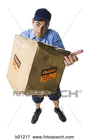 High angle view of a mailman holding a damaged package View Large Photo Image Stock Photo - High angle view of a mailman holding a damaged package. Fotosearch