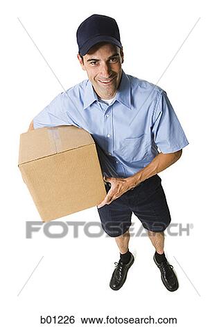 High angle view of a mailman holding a package View Large Photo Image Stock Photograph - High angle view of a mailman holding a package. Fotosearch