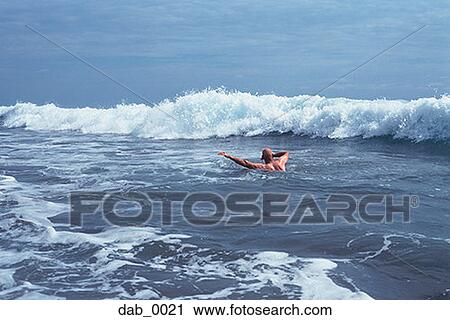 High angle view of a man swimming in the sea View Large Photo Image Stock Image - High angle view of a man swimming in the sea. Fotosearch
