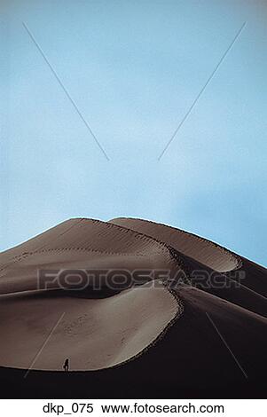 High angle view of a person on a sand dune View Large Photo Image Stock Photography - High angle view of a person on a sand dune. Fotosearch