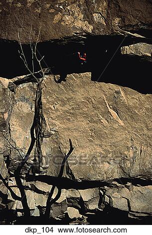 High angle view of a person rock climbing View Large Photo Image Picture - High angle view of a person rock climbing. Fotosearch