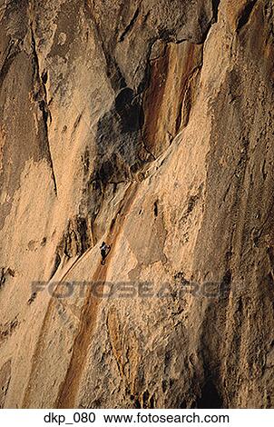 High angle view of a person rock climbing View Large Photo Image Stock Image - High angle view of a person rock climbing. Fotosearch