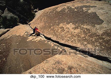 High angle view of a person rock climbing View Large Photo Image Stock Image - High angle view of a person rock climbing. Fotosearch