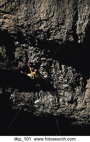 High angle view of a person rock climbing View Large Photo Image Stock Image - High angle view of a person rock climbing. Fotosearch