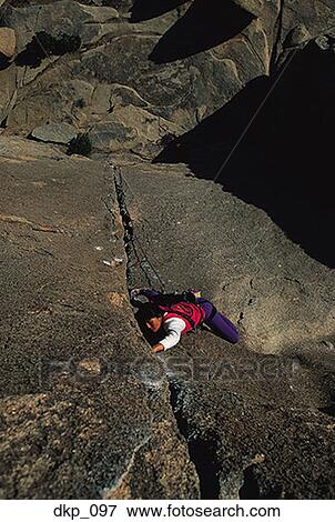 High angle view of a person rock climbing View Large Photo Image Stock Photo - High angle view of a person rock climbing. Fotosearch