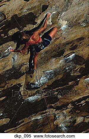 High angle view of a person rock climbing View Large Photo Image Stock Photography - High angle view of a person rock climbing. Fotosearch