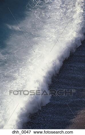 High angle view of a wave on the shore View Large Photo Image Stock Photo - High angle view of a wave on the shore. Fotosearch