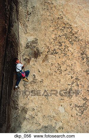 High angle view of a young boy rock climbing View Large Photo Image Stock Photograph - High angle view of a young boy rock climbing. Fotosearch