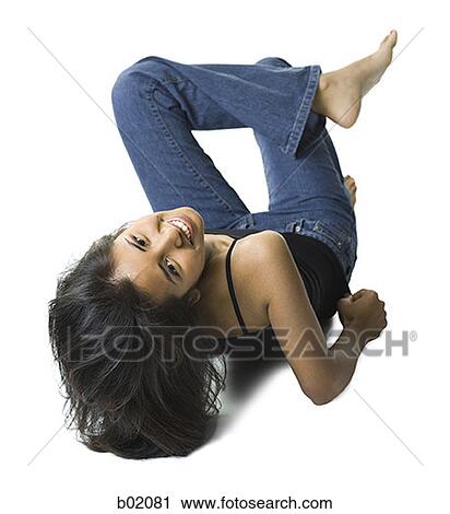 High angle view of a young woman smiling View Large Photo Image Stock Image - High angle view of a young woman smiling. Fotosearch