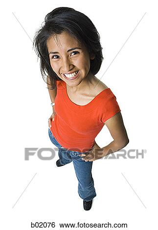 High angle view of a young woman smiling View Large Photo Image Stock Photograph - High angle view of a young woman smiling. Fotosearch