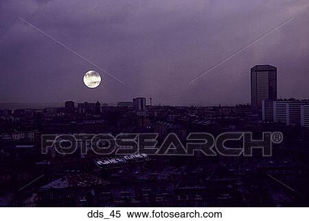 Stock Photography - High angle view of buildings in a city at night. Fotosearch