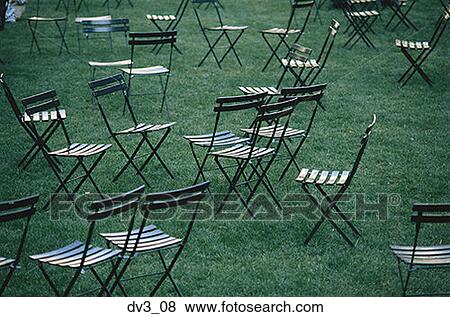 Stock Photo - High angle view of chairs on a lawn. Fotosearch