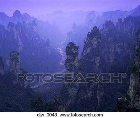 High angle view of mountain ridges and a river running through a valley View Large Photo Image Stock Photo - High angle view of mountain ridges and a river running through a valley. Fotosearch