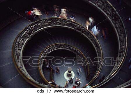 High angle view of people walking on a spiral staircase View Large Photo Image Stock Photo - High angle view of people walking on a spiral staircase. Fotosearch