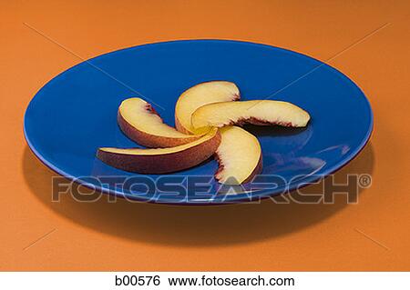 High angle view of slices of apple on a plate (Malus domestica) View Large Photo Image Stock Photograph - High angle view of slices of apple on a plate (Malus domestica). Fotosearch