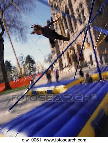 Low angle view of a child playing in a playground View Large Photo Image Stock Image - Low angle view of a child playing in a playground. Fotosearch
