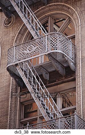 Low angle view of a fire escape outside a building View Large Photo Image Stock Photo - Low angle view of a fire escape outside a building. Fotosearch