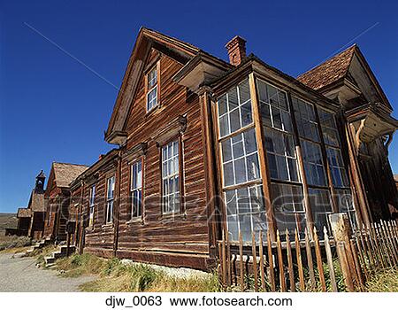 Stock Image - Low angle view of a log cabin. Fotosearch