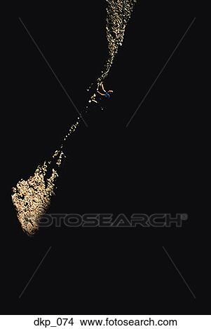 Low angle view of a man rock climbing View Large Photo Image Picture - Low angle view of a man rock climbing. Fotosearch