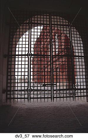 Low angle view of a metal grate on an arched entrance View Large Photo Image Stock Photo - Low angle view of a metal grate on an arched entrance. Fotosearch