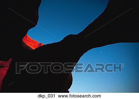 Low angle view of a rock arch formation in a canyon View Large Photo Image Stock Image - Low angle view of a rock arch formation in a canyon. Fotosearch