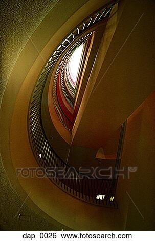Low angle view of a spiral staircase View Large Photo Image Stock Photograph - Low angle view of a spiral staircase. Fotosearch