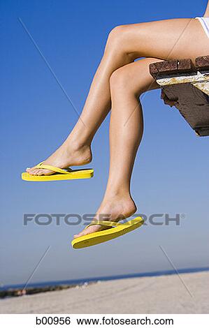 Stock Photograph - Low angle view of a woman's legs. Fotosearch