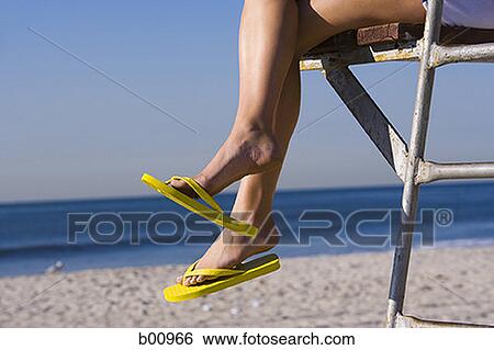 Low angle view of a woman's legs View Large Photo Image Stock Photograph - Low angle view of a woman's legs. Fotosearch