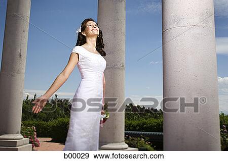 Low angle view of a young modern bride View Large Photo Image Stock Photo - Low angle view of a young modern bride. Fotosearch