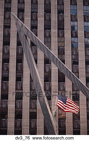 Low angle view of an American flag outside a building View Large Photo Image Stock Photograph - Low angle view of an American flag outside a building. Fotosearch