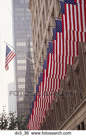 Low angle view of an array of American flags on a building View Large Photo Image Stock Photograph - Low angle view of an array of American flags on a building. Fotosearch