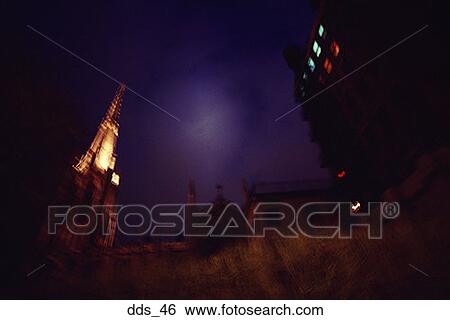 Stock Photograph - Low angle view of buildings at night. Fotosearch
