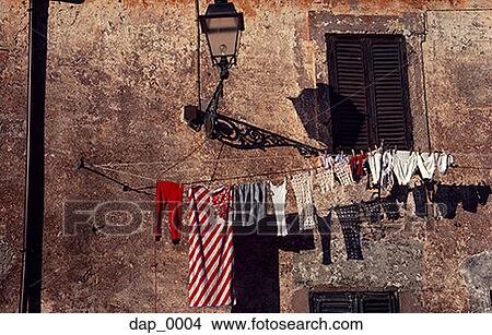 Picture - Low angle view of clothes hanging on a clothesline. Fotosearch