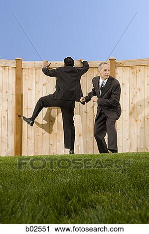 Low angle view of two businessmen playing View Large Photo Image Stock Image - Low angle view of two businessmen playing. Fotosearch