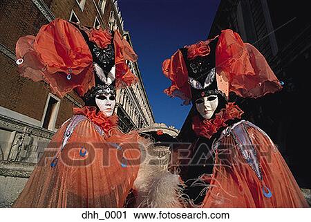 Low angle view of two people in masquerade costumes View Large Photo Image Stock Image - Low angle view of two people in masquerade costumes. Fotosearch