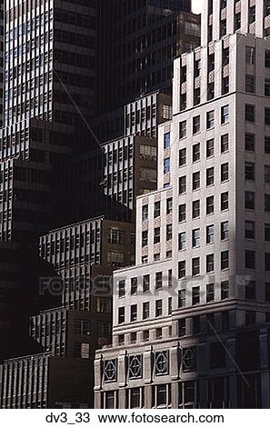 Stock Image - Low angle view of two tall buildings. Fotosearch