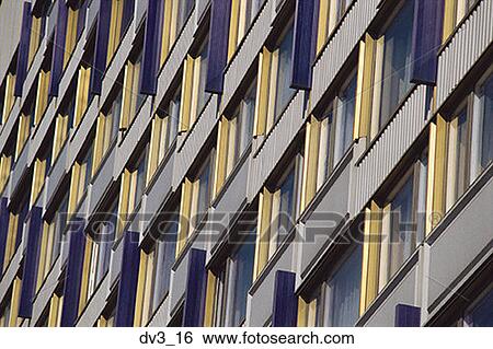 Low angle view of windows of a building View Large Photo Image Stock Photograph - Low angle view of windows of a building. Fotosearch