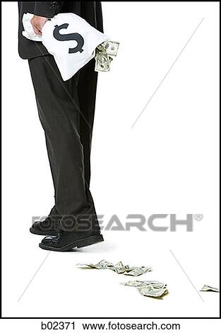Low section view of a business holding a bag of money View Large Photo Image Stock Image - Low section view of a business holding a bag of money. Fotosearch