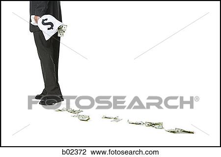 Stock Image - Low section view of a business holding a bag of money. Fotosearch