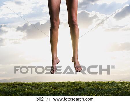 Low section view of human legs jumping in the air View Large Photo Image Stock Image - Low section view of human legs jumping in the air. Fotosearch