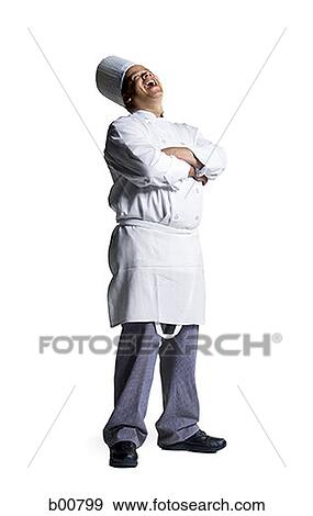 Male chef standing with his arms folded View Large Photo Image Stock Photo - Male chef standing with his arms folded. Fotosearch