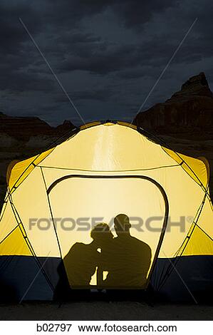 Man and a woman sitting in a tent View Large Photo Image Stock Photo - Man and a woman sitting in a tent. Fotosearch